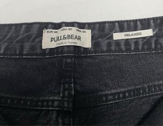 Pantalones vaqueros grises rotos