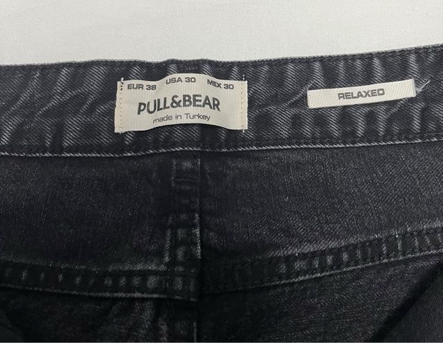 Pantalones vaqueros grises rotos