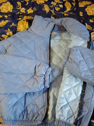 Piumino azzurro taglia S