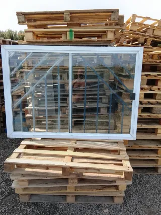 Ventana aluminio corredera con rejas