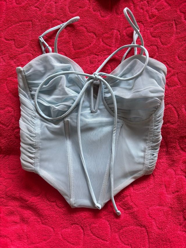 Top azul claro con lazo