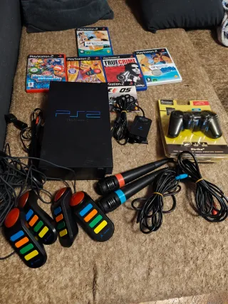 Lote PlayStation 2 con juegos y accesorios