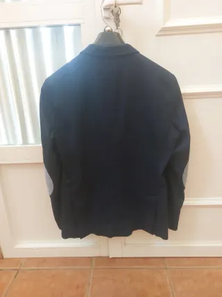 Americana juvenil azul con coderas