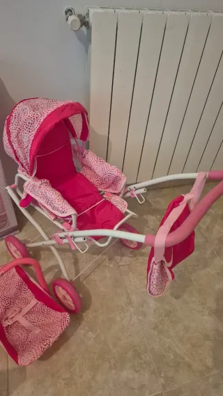 Carrito de muñecas rosa con accesorios