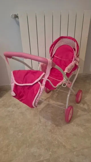 Carrito de muñecas rosa con accesorios
