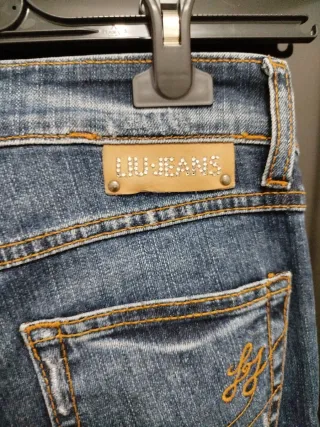 Jeans donna blu strappati