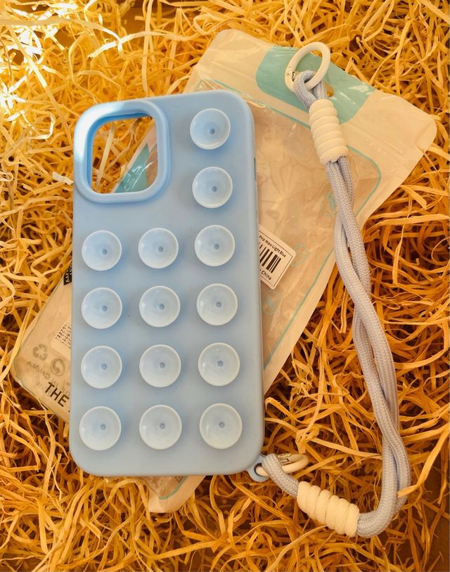 Funda móvil azul con ventosas y cordón