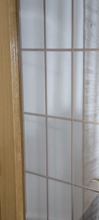 Puerta de roble acristalada