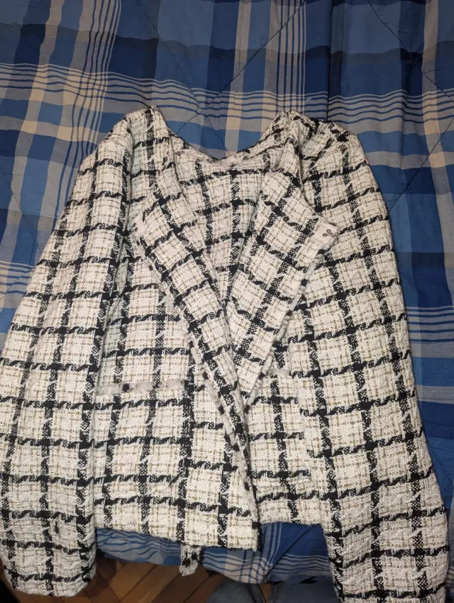 Maglione a quadri bianca e nera