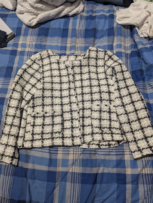 Maglione a quadri bianca e nera