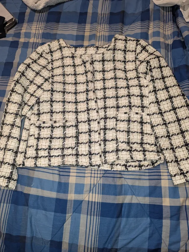 Maglione a quadri bianca e nera