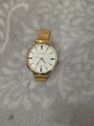 Reloj SKYLINE dorado y blanco