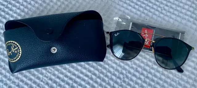 Gafas de sol mujer Ray-Ban negras y doradas