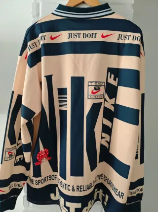 Polo Nike manga larga beige y azul