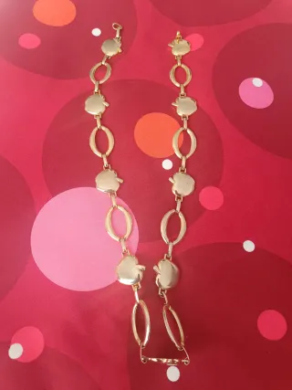 Cinturón vintage dorado con manzanas