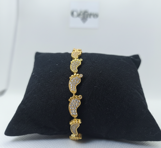 Pulsera pies de bebé dorado con circonitas