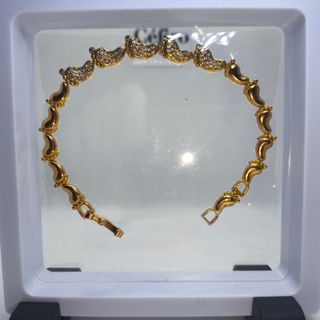 Pulsera pies de bebé dorado con circonitas