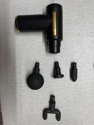 Pistola Masajeador Muscular Negra y Dorada