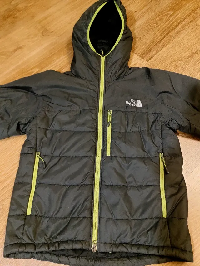 Chaqueta The North Face Primaloft Gris oscura.
