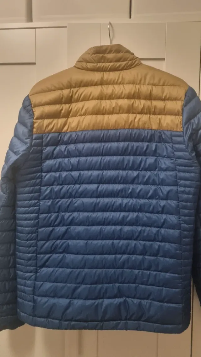 Chaqueta The North Face plumas azul/amarillo