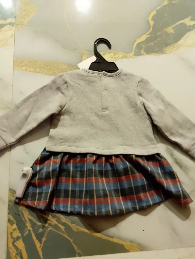 Conjunto bebé niña falda cuadros Newness.Talla 12M