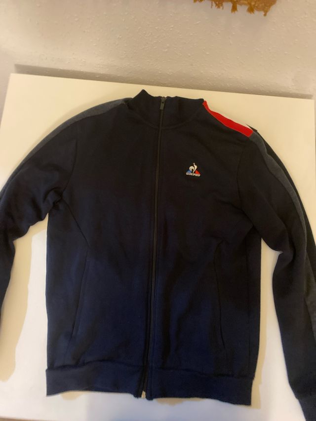 Chaqueta Le Coq Sportif azul y roja sin usar