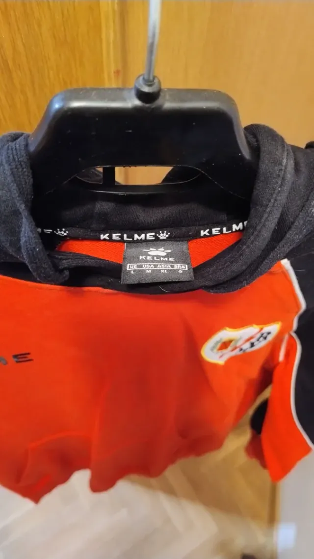 Sudadera Kelme Rayo Vallecano Naranja y Negra