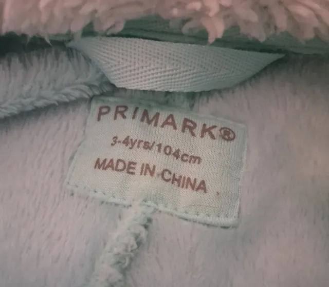 Buzo polar Primark arcoíris y nubes