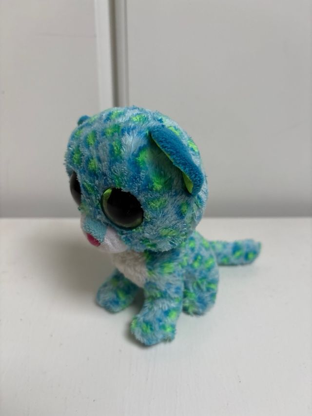 Peluche ojos grandes azul y verde