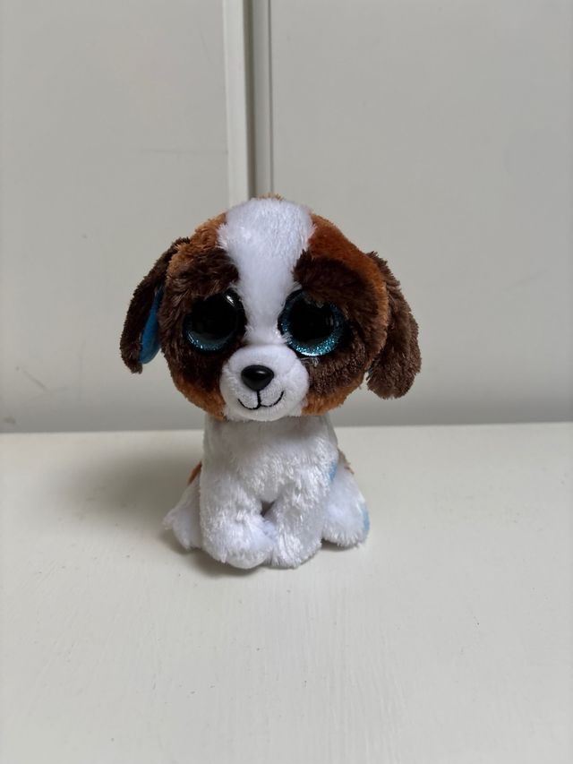 Peluche perro ojos grandes