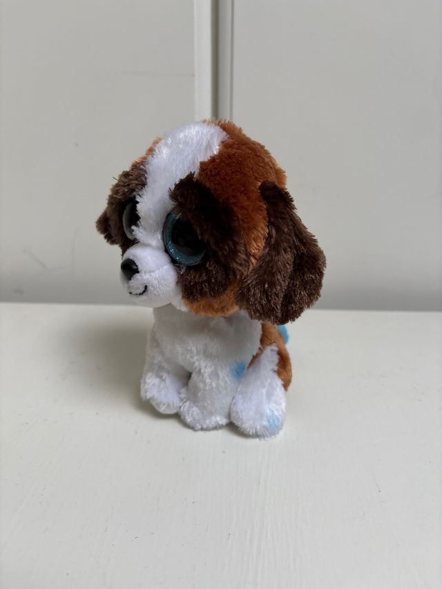 Peluche perro ojos grandes