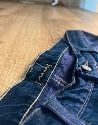 Jeans viola strappati taglia 46/W36