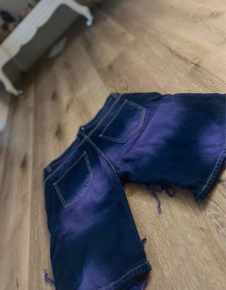Jeans viola strappati taglia 46/W36