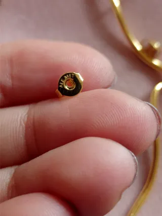 Pendientes dorados línea ondulada plata