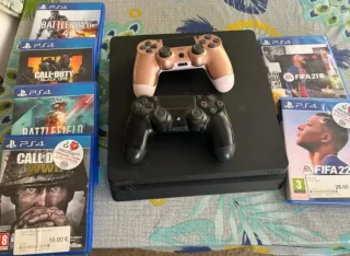 PS4 (PlayStation 4) con 2 mandos y juegos