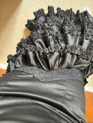 Traje de flamenca negro con volantes