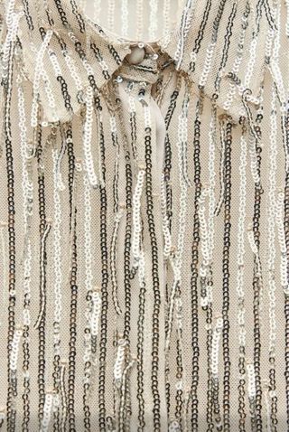 Camisa flecos y lentejuelas