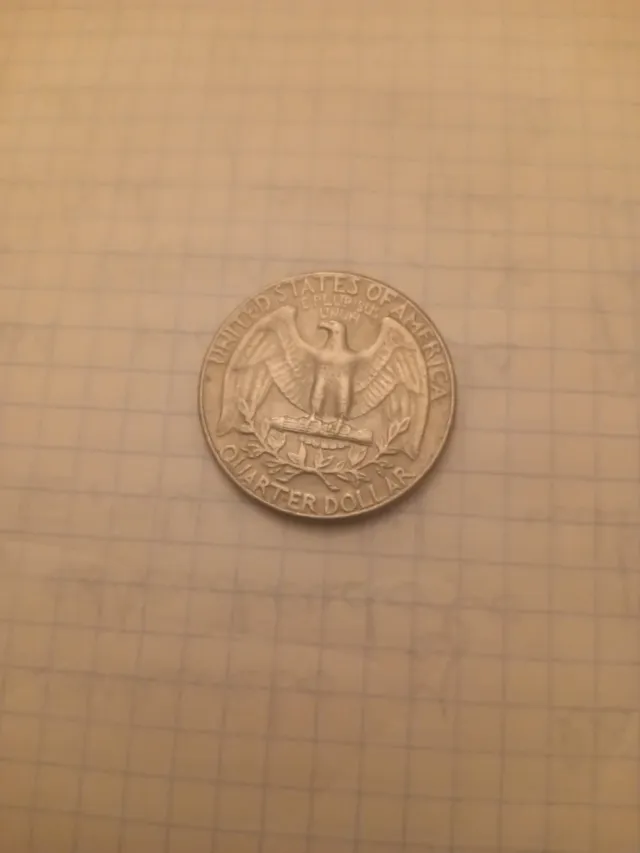 Moneda de 25 centavos de dólar con error