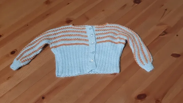 Chaqueta bebé tejida azul y naranja