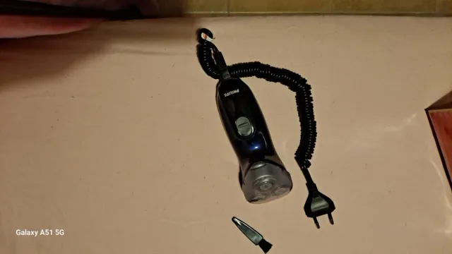 Máquina de afeitar Philips azul y plateada