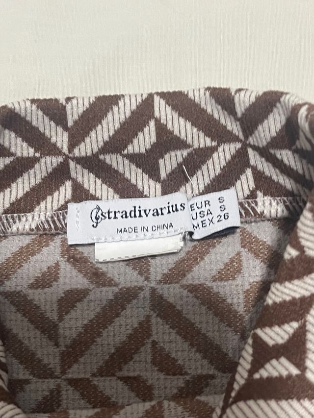 Top estampado geométrico manga larga