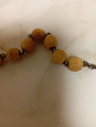 Rosario de cuentas y reliquia