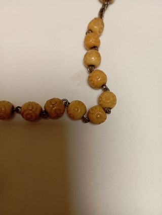 Rosario de cuentas y reliquia