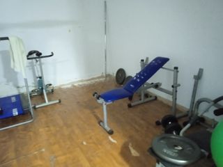 Banco de pesas, discos hasta 125kg y más