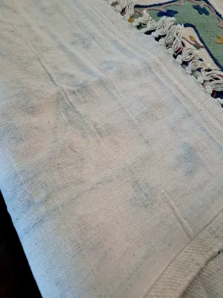 Tappetino ricamato con frange