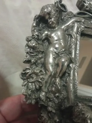 Espejo de plata antiguo con querubines