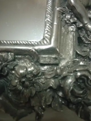 Espejo de plata antiguo con querubines