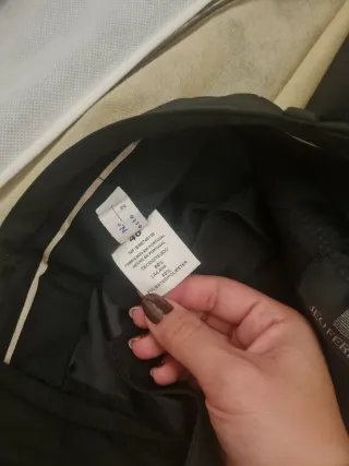 Traje americana y pantalón negro