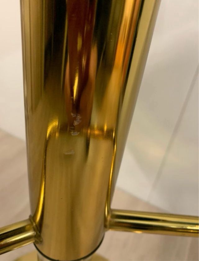 Taburete de terciopelo negro y dorado