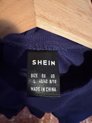 Jersey azul con mangas abullonadas